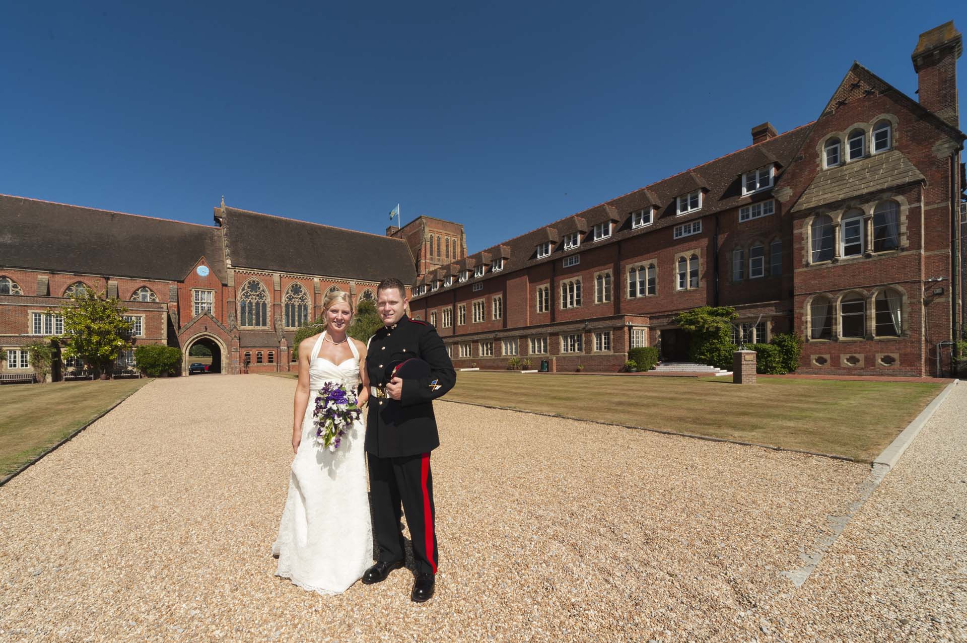 Sussex wedding at Ardingly College bride and groom in front of the school