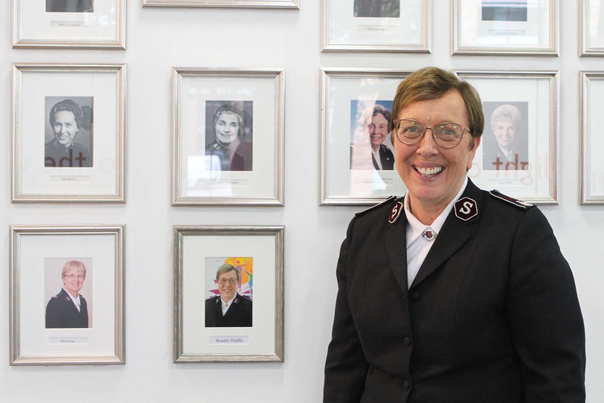 Commissioner Rosalie Peddle with her portrait at Salvation Army IHQ